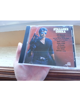CD Banda Sonora de la película de Cobra Protagonizada por Sylvester Stallone del año 1986 Edición Estadounidense